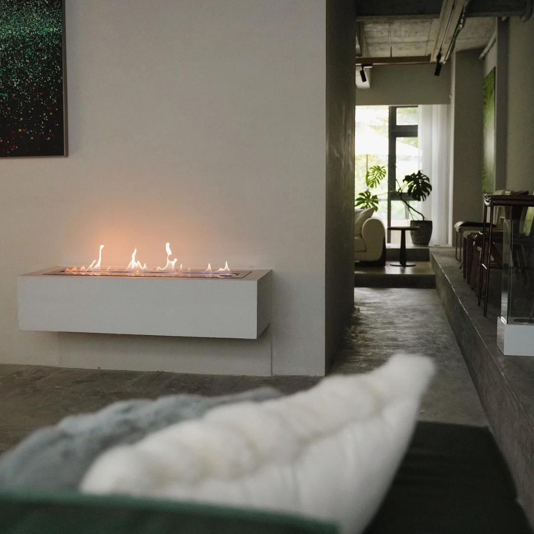A floating fire on a plain wall.